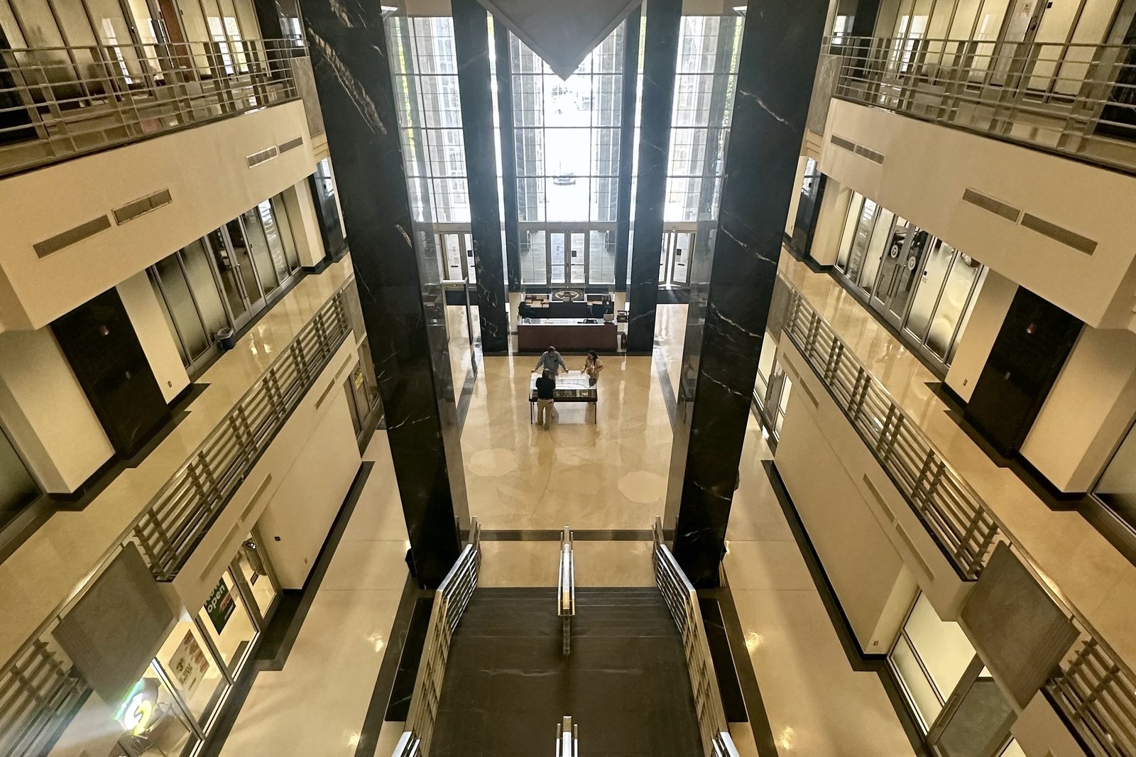 Looking down the atrium stairs toward the lobby